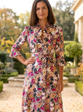Ridley_London_Burgundy_Gold_Painters_Bouquet_Liberty_Print_Silk_Satin_Oriana_Dress_With_Ruffled_Neck_And_Ruffled_Cuff_Three_Quarter_Length_Sleeves